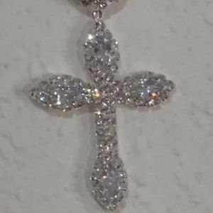 This is a beautiful cross silver plated with lab made diamonds